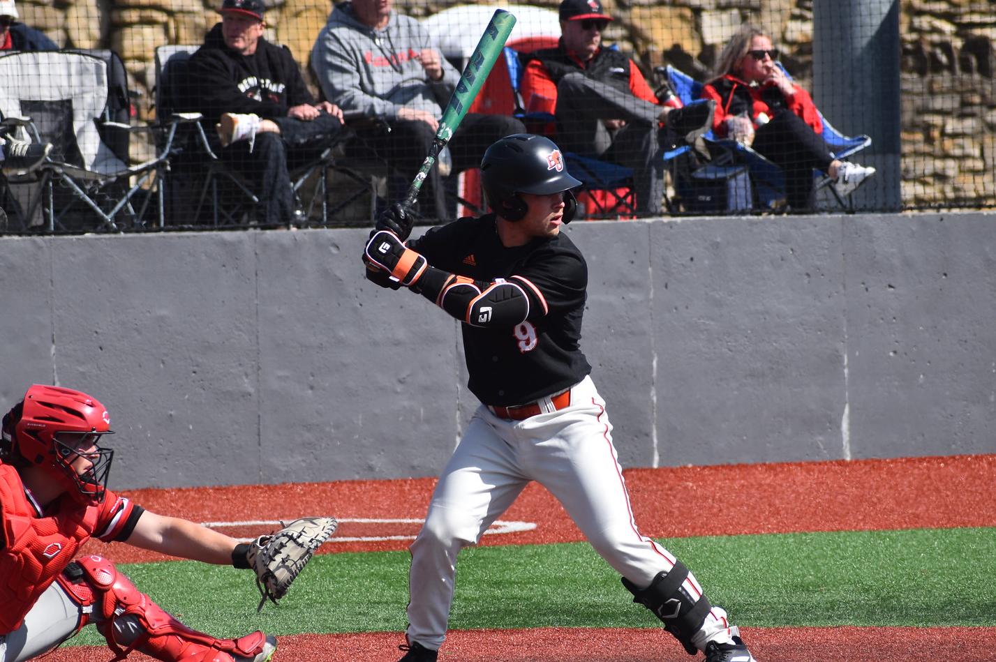 Baker baseball player Camden Karlin hitting at home
