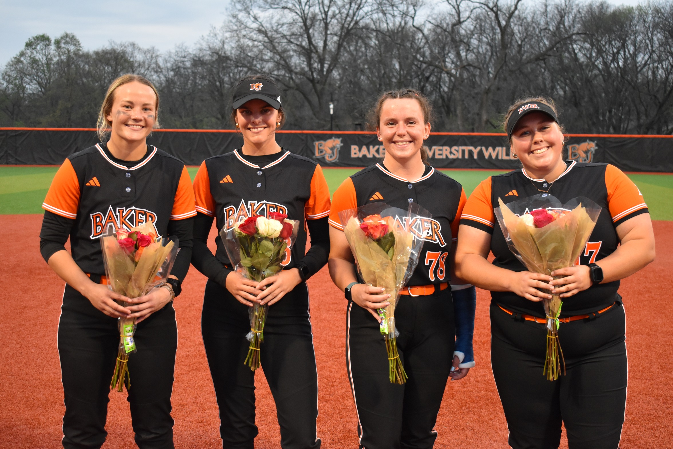 2026 Baker softball senior class, from left to right, Gracie Gallagher, Rachel Pederson, Kira Baker and Taryn Hull